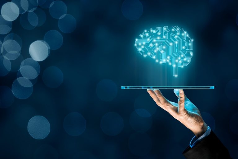 A digital brain image above the tablet which discribe's machine learning